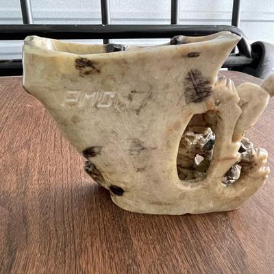Asian stone carving - tending to the flock