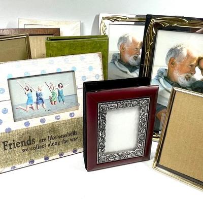 Lot of picture frames and photo books various sizes