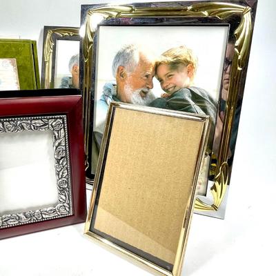 Lot of picture frames and photo books various sizes