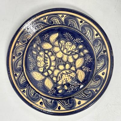 Terra Cotta plate indigo blue and creamy white floral pattern signed by artist
