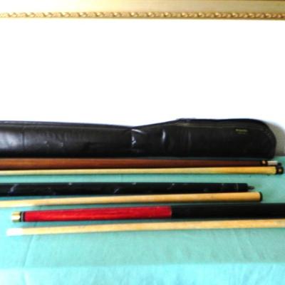 THREE PROFFESIONAL POOL CUES AND BOX OF CHAULK CUE CUBES