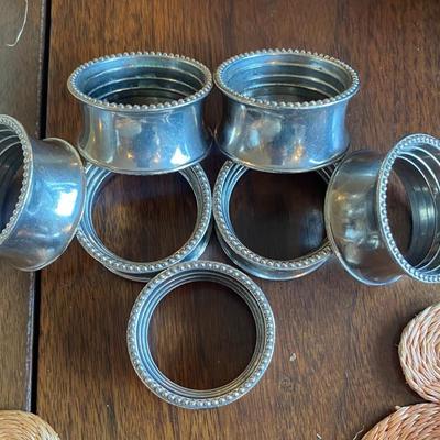 9 silver plate napkin rings 