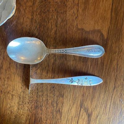 1 - Sterling silver baby food pusher and 1 Sterling baby spoon engraved with "Susan" 