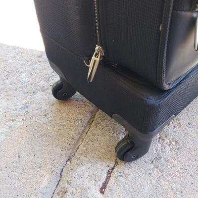 FOUR WHEELED HANDLED PORTIBLE CASE AND SUITCASE
