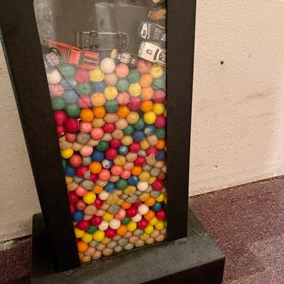A double sided 25 cent gumball machine.