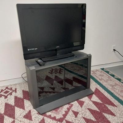 32"XIZIO WITH REMOTE AND GLASS FRONT STAND WITH STORAGE