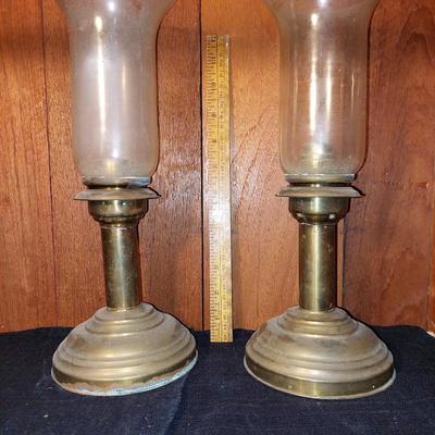 Pair of brass and glass candle sticks