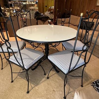 Polished white with tulip style medal pedestal and 6 metal and freshly upholstered chairs