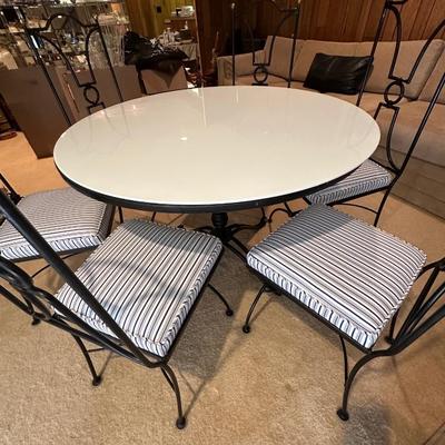 Polished white with tulip style medal pedestal and 6 metal and freshly upholstered chairs