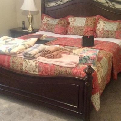 King bed, linens, oil paintings