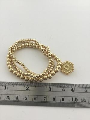 Gold tone letter D fashion beaded bracelets
