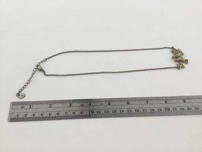 Claire’s gold tone bird necklace