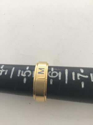 M. Marked gold tone ring