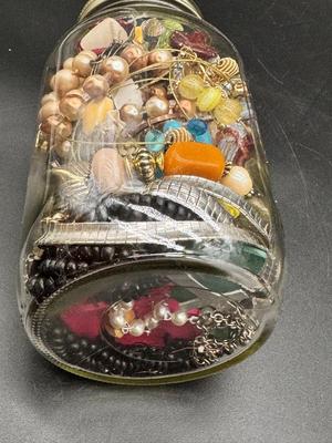 Pint jar of craft jewelry beads and parts