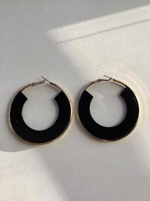Gold tone and black hoop earrings