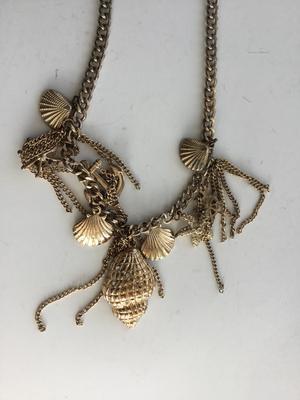 Gold tone charm sea necklace