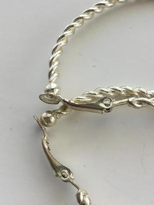 Beautiful silver tone loop faux earrings