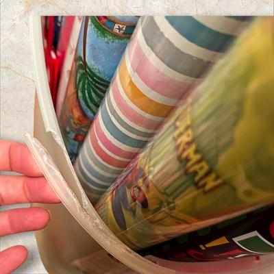 Tub Chock Full of Wrapping Paper Rolls