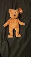 Vintage Ty Beanie Baby brown bear plush toy with original heart-shaped hang tag.