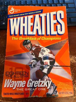 Vintage Wheaties cereal box flat featuring Wayne Gretzky, showing some wear along the edges and corners.