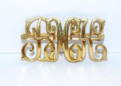 Gold Colored "BMK" BROOCH (2" x 1") on a Gold Tone Setting