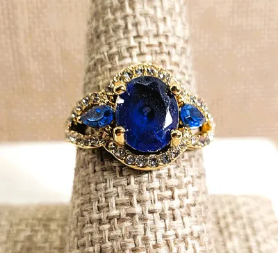 **New Arrival** Size 7¾ Large BLUE Oval Stone RING with Long Bejeweled Surround and 2 Pear Blue Stone Side Accents on a Gold Tone Setting...