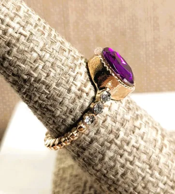 **New Arrival** Size 6¾ Oval PURPLE Stone "Cupped" RING with 3 Small Clear Stones Each Side Accents on a Thin Swirl Gold Tone...