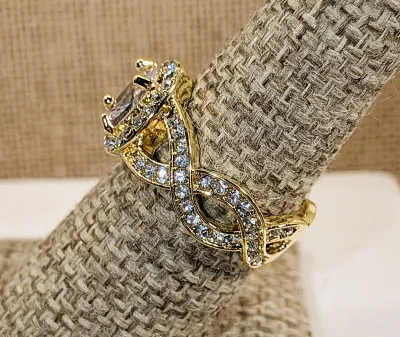 **New Arrival** Size 7¾ Ornate Bejeweled Clear Oval Main Stone RING with Side Loop Accents and Interesting Looped Gold Tone Setting &...