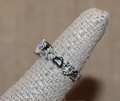 Size 7½ "LOTS OF HEARTS" RING with Clear Heart Main Stone & Bejeweled Hearts on the Silver Tone Band (2.7g)