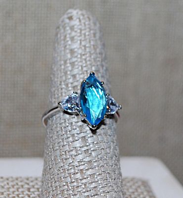Size 8 Long Marquise Cut Light BLUE Main Stone RING with 2 Clear HEART Shaped Accent Stones on a Silver Tone Setting and Band (3.2g)