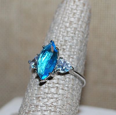 Size 8 Long Marquise Cut Light BLUE Main Stone RING with 2 Clear HEART Shaped Accent Stones on a Silver Tone Setting and Band (3.2g)