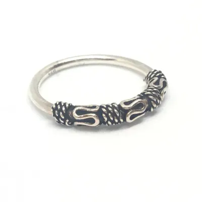 Sale Photo Thumbnail #337: Sukartini from Bali presents a glorious accessory full of tradition and elegance. Crafted by local artisans, this sterling silver band ring comes with sinuous and classic details around the front, all in a polished finish that enhances its splendorous vib