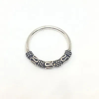 Sale Photo Thumbnail #338: Sukartini from Bali presents a glorious accessory full of tradition and elegance. Crafted by local artisans, this sterling silver band ring comes with sinuous and classic details around the front, all in a polished finish that enhances its splendorous vib