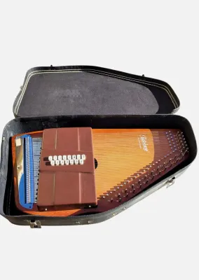 Sale Photo Thumbnail #288: Autoharp OS15B This 15-chord autoharp plays in seven different keys. The traditional button configuration makes it easy to learn and to continue to play for years to come. This is one of our most popular models. Good condition, all additional parts and in