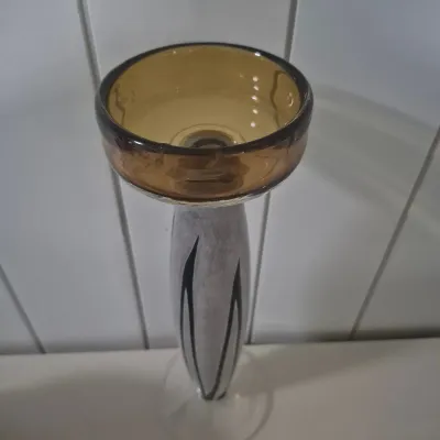 Sale Photo Thumbnail #292: MCM Studio Art Glass pillar candle holder @1960 
Description
Vintage art Glass pillar candle holder features a rich amber bowl with pedestal of swirling black and white on a clear glass base.designed for a pillar candle on any decorno damage, no chips, cr