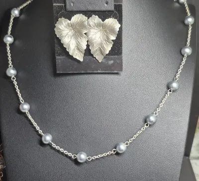 Sale Photo Thumbnail #178: Gray Pearl Necklace w/ pewter leaf Earrings
> necklace is gray pearls evenly spaced by sterling chain.....16" 
> pewter earring in Leaf form w/ post backs....unbranded