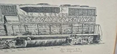 Sale Photo Thumbnail #226: Ink Drawing of "Seaboard Coast Line" Diesel ~ signed / numbered
litho pen n ink of Seaboard diesel, numbered 328 /600
signed:  in litho & by artist Betty Sedberry "82
silver modern frame , acrylic cover, 15"/ 13"