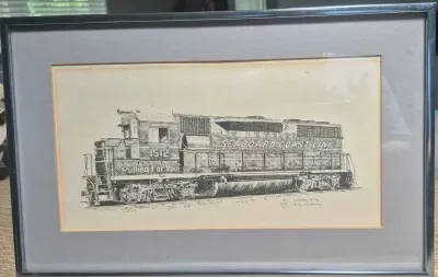 Sale Photo Thumbnail #225: Ink Drawing of "Seaboard Coast Line" Diesel ~ signed / numbered
litho pen n ink of Seaboard diesel, numbered 328 /600
signed:  in litho & by artist Betty Sedberry "82
silver modern frame , acrylic cover, 15"/ 13"