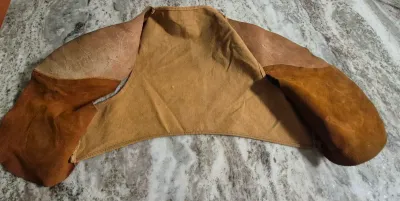 Sale Photo Thumbnail #295: Keyston Bros. "Lasso 'Em Bill" kids suede leather vest
> steer & flower applique still original
> suede in great shape....ready for the next cow kid !
> minor stitch repair under arm
> Size: 10" shoulders / 15" body / 14" height