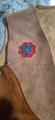 Sale Photo Thumbnail #294: Keyston Bros. "Lasso 'Em Bill" kids suede leather vest
> steer & flower applique still original
> suede in great shape....ready for the next cow kid !
> minor stitch repair under arm
> Size: 10" shoulders / 15" body / 14" height
