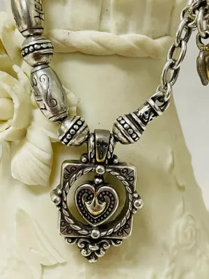 Sale Photo Thumbnail #390: Share the love with this Brighton silver-tone heart jewelry collection featuring a bracelet, a matching pair of heart stud earrings, and a single coordinating heart drop earring with gold-tone heart accents
Complete set:  4 pcs