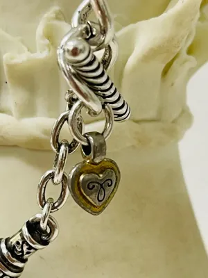 Sale Photo Thumbnail #391: Share the love with this Brighton silver-tone heart jewelry collection featuring a bracelet, a matching pair of heart stud earrings, and a single coordinating heart drop earring with gold-tone heart accents
Complete set:  4 pcs
