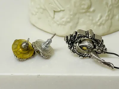 Sale Photo Thumbnail #395: Share the love with this Brighton silver-tone heart jewelry collection featuring a bracelet, a matching pair of heart stud earrings, and a single coordinating heart drop earring with gold-tone heart accents
Complete set:  4 pcs