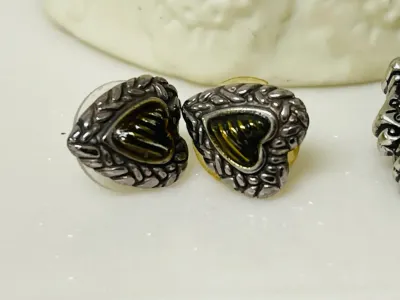 Sale Photo Thumbnail #394: Share the love with this Brighton silver-tone heart jewelry collection featuring a bracelet, a matching pair of heart stud earrings, and a single coordinating heart drop earring with gold-tone heart accents
Complete set:  4 pcs