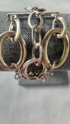Sale Photo Thumbnail #410: RALPH LAUREN Signed Silver Stine 3 Strand Large Link Bracelet 6.25" & hinged Stainless Choker & 925 Onyx Ring
> hinged steel Choker in excellent condition, hing works effortlessly
> Ring is marked sterling and Navajo maker mark with arrow.....Size 8
Wonde