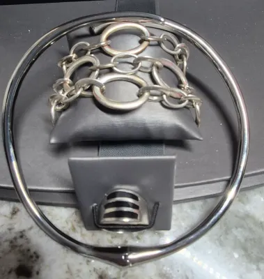 Sale Photo Thumbnail #408: RALPH LAUREN Signed Silver Stine 3 Strand Large Link Bracelet 6.25" & hinged Stainless Choker & 925 Onyx Ring
> hinged steel Choker in excellent condition, hing works effortlessly
> Ring is marked sterling and Navajo maker mark with arrow.....Size 8
Wonde