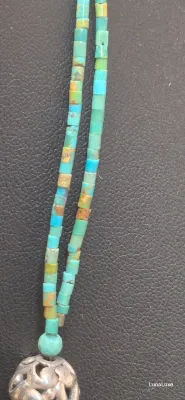 Sale Photo Thumbnail #440: Showcase Southwestern style with this Barse sterling silver necklace featuring genuine turquoise beads, ornate sterling accents, and a bold turquoise pendant that makes a striking statement with both casual and dressy looks.

Stamped Barse 925
16” plus 