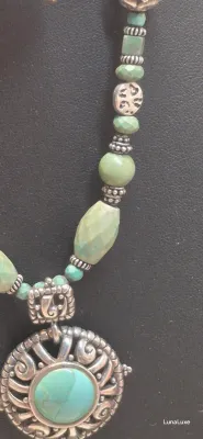 Sale Photo Thumbnail #438: Showcase Southwestern style with this Barse sterling silver necklace featuring genuine turquoise beads, ornate sterling accents, and a bold turquoise pendant that makes a striking statement with both casual and dressy looks.

Stamped Barse 925
16” plus 