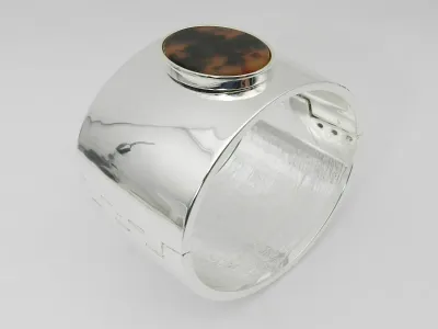 Sale Photo Thumbnail #448: Lauren Ralph Lauren Silver-Tone Tortoise Wide Bangle Bracelet  
 100% authentic Ralph Lauren Bracelet
Approx. diameter: 2-1/2"
Set in silver-tone mixed metal; acetate
Hinge closure
 Condition:  New without  tag. Store display