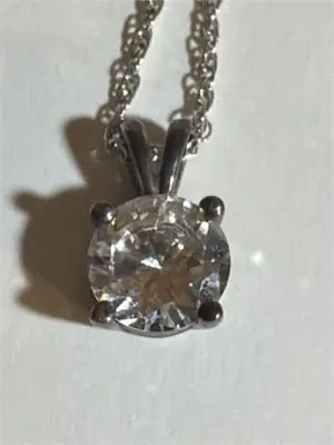Sale Photo Thumbnail #109: Women's Vintage Diamonique CZ Stone Sterling silver
Women's Vintage Diamonique Sterling silver ZZ stone [ 2.84 g ]   very rare  18 inches chain length
stone is .50"
enclosed in original presentation box